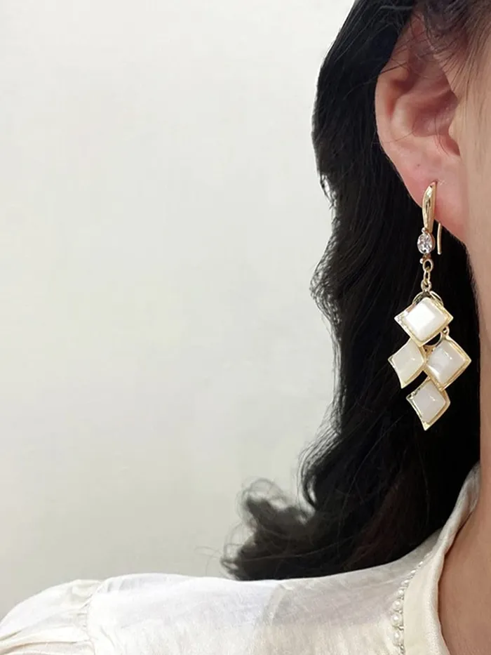 Necklaces Yellow Chimes Yellow Chimes Earrings For Women White Color Crystal Studded Geometrical Shape Drop Earrings For Women and Girls