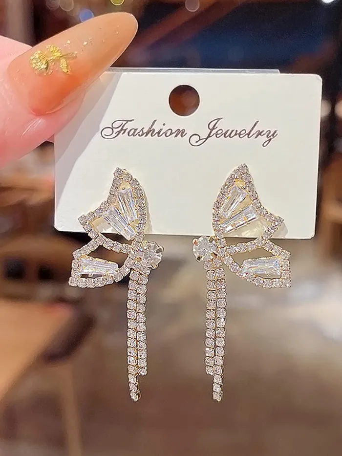 Yellow Chimes Earrings For Women Gold Tone Sparkling Crystal Studded Butterfly Shaped Chain Tassel Hanging Drop Earrings For Women and Girls Yellow Chimes Bracelets